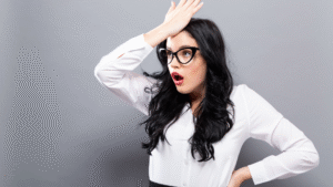 Surprised businesswoman realizing a mistake, representing common entrepreneur mistakes in business.