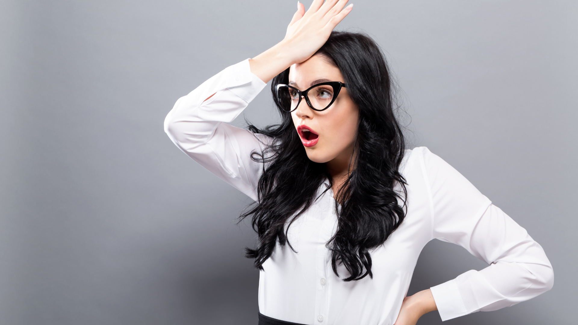 Surprised businesswoman realizing a mistake, representing common entrepreneur mistakes in business.