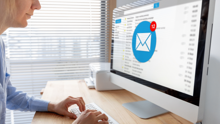 A professional working on a computer with an inbox open, illustrating SaaS email marketing campaigns and digital communication strategies.