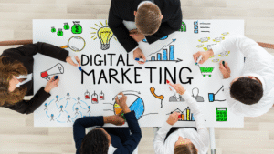 Business team brainstorming digital marketing strategies with charts, graphs, and icons on a whiteboard