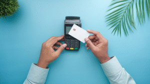 Person making payment using a credit card on a POS machine