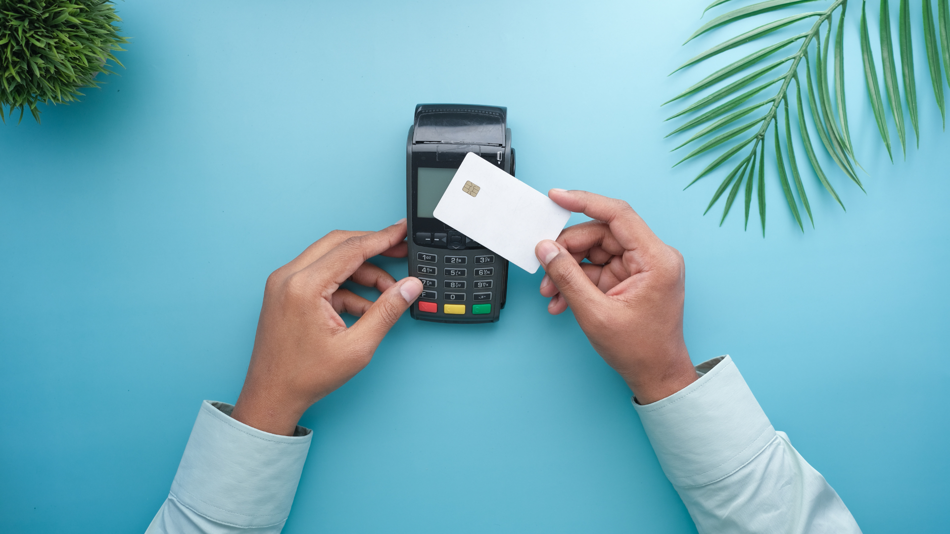 Person making payment using a credit card on a POS machine