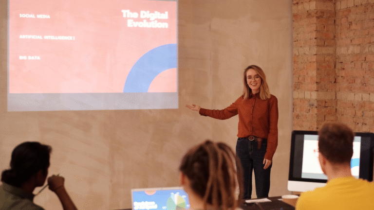 Educator presenting AI trends in education to a group of students with a projected slide showing topics like artificial intelligence and big data.