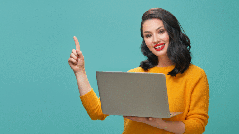 Smiling woman holding a laptop and pointing upward, symbolizing creative uses of ChatGPT for productivity and online tasks.