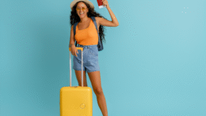 Smiling woman with suitcase and passport ready for vacation, representing a happy traveler booking a tourist package