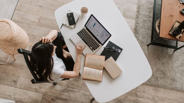 Person working on a laptop with analytics on screen, representing SEO in 2026: How Google’s new algorithms will change ranking.