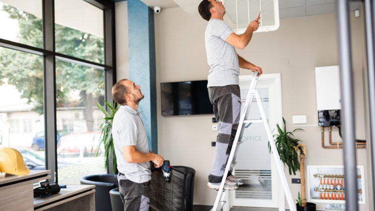 Common home maintenance mistakes people make, shown by homeowners inspecting an air vent and HVAC system indoors