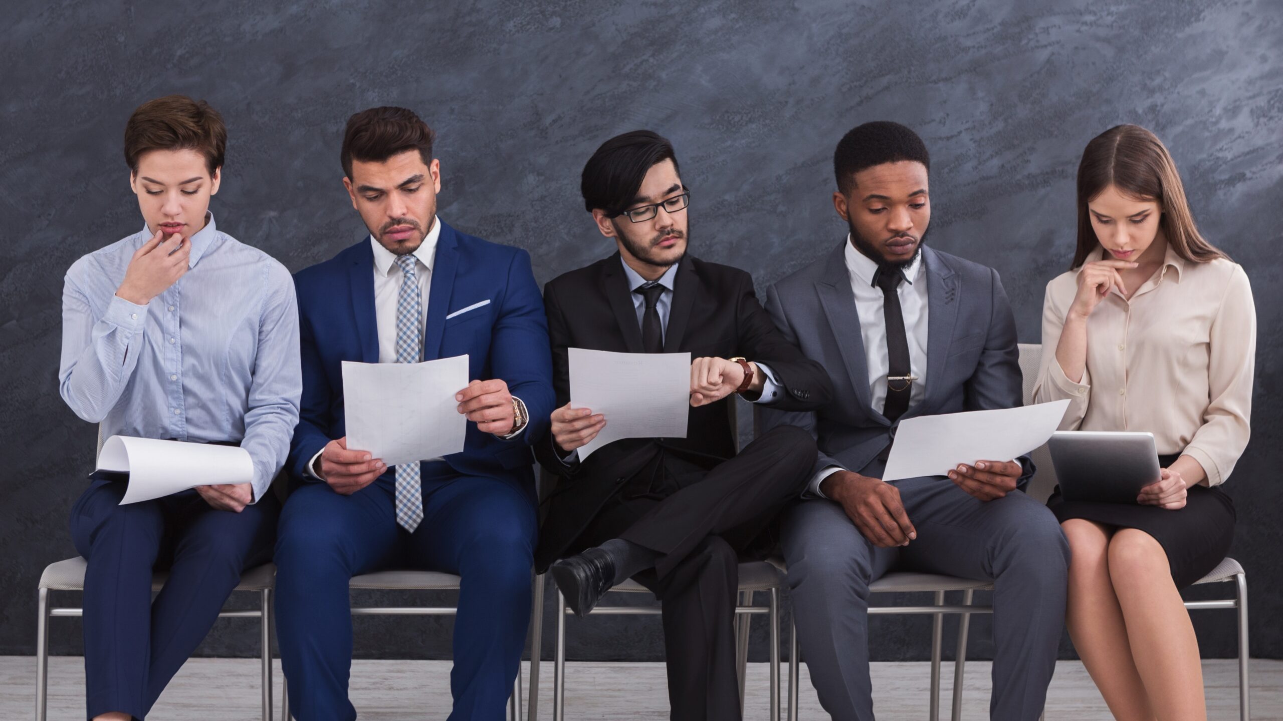 How Freshers Can Get Jobs Without Referrals represented by fresh graduates analyzing job documents in a professional setting