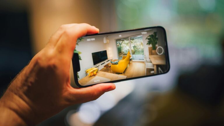 Smartphone capturing an indoor living room scene, demonstrating mobile photography techniques.