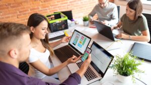 Team collaborating on website design and optimization strategies to increase website traffic