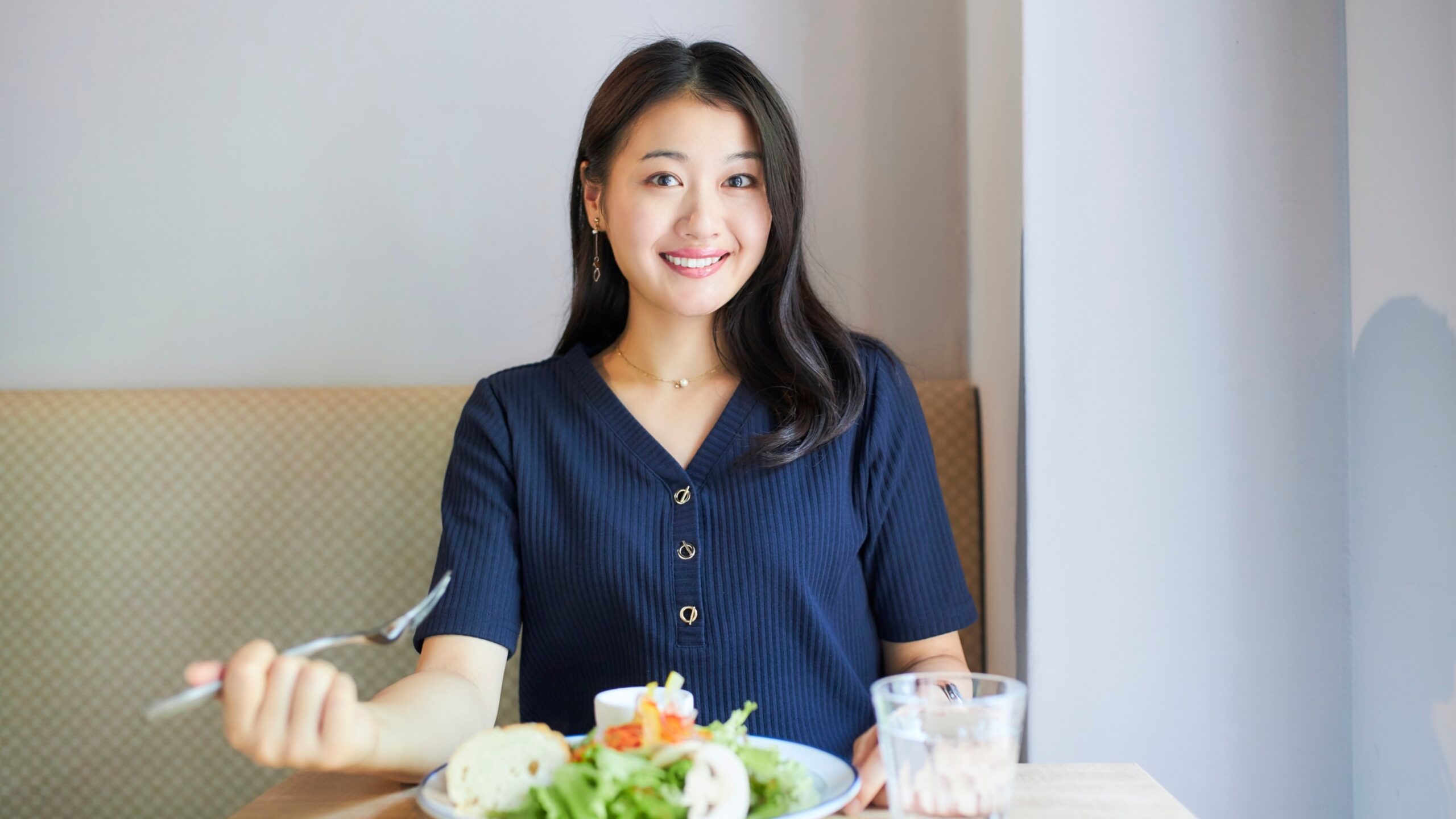 Skipping Meals Affects Your Body shown by a woman eating a balanced meal indoors