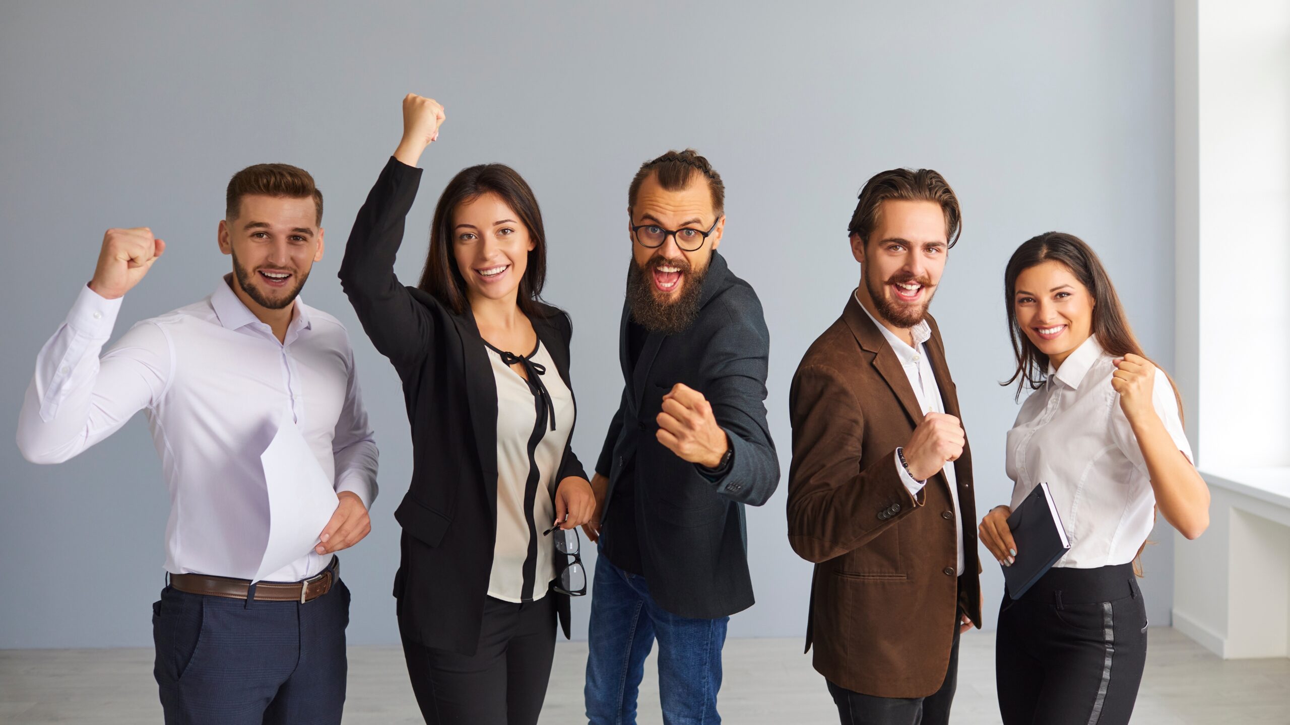 Negotiation Tactics for Entrepreneurs: Closing Deals Effectively shown through a confident business team celebrating a successful agreement in a modern office.