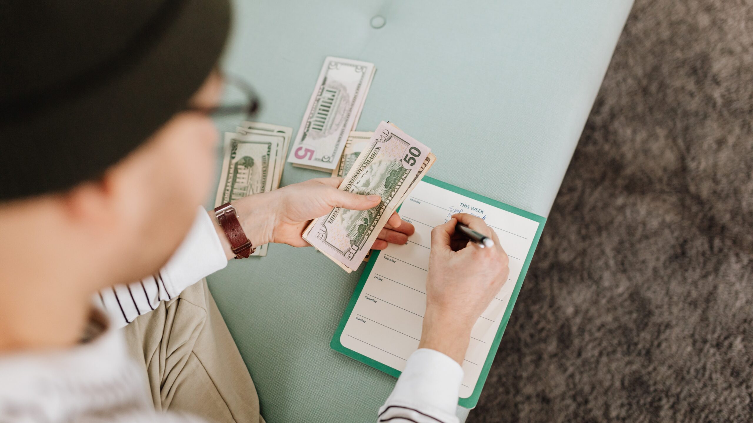 Personal Finance Tips for Millennials: Saving for the Future represented by a millennial tracking expenses and organizing savings goals.