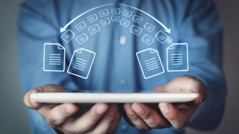 Easy Ways to Back Up Your Photos and Files illustrated with cloud file transfer icons above a tablet