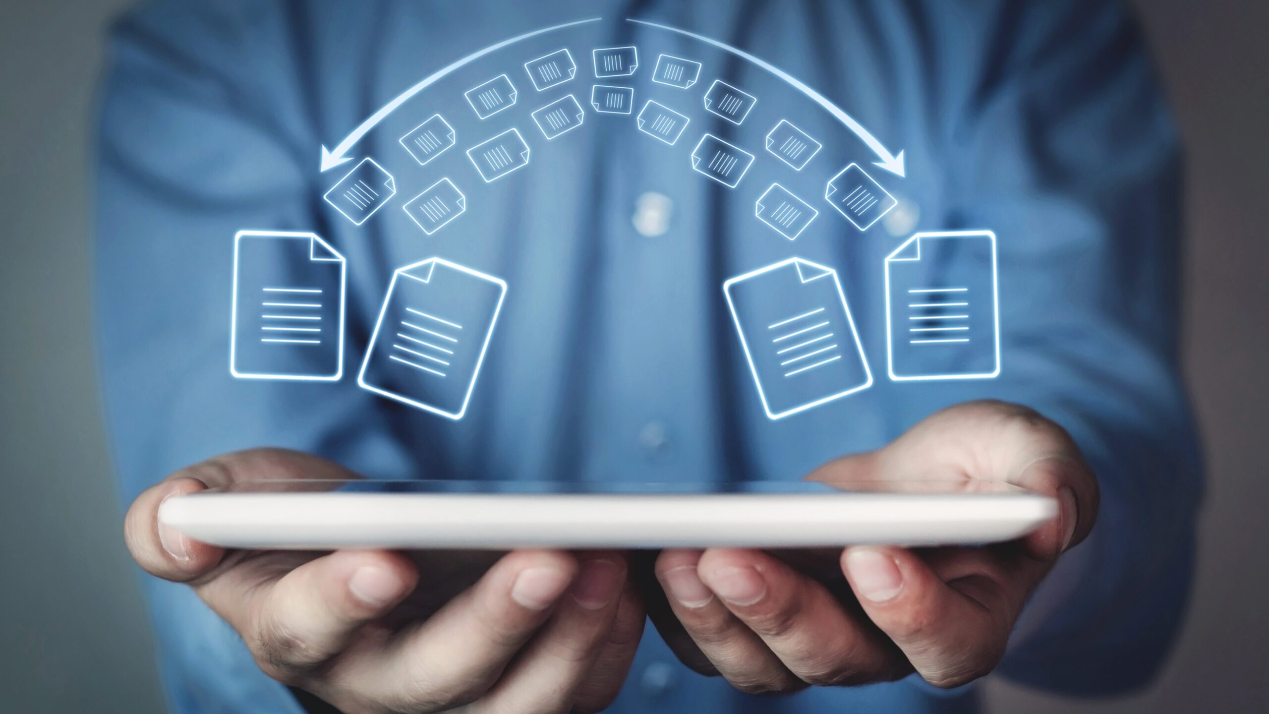 Easy Ways to Back Up Your Photos and Files illustrated with cloud file transfer icons above a tablet