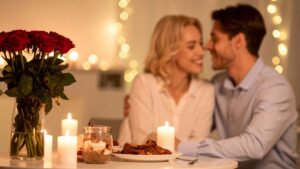 Romantic candlelit dinner with roses and dessert, perfect for budget date night ideas at home for couples that actually feel special.
