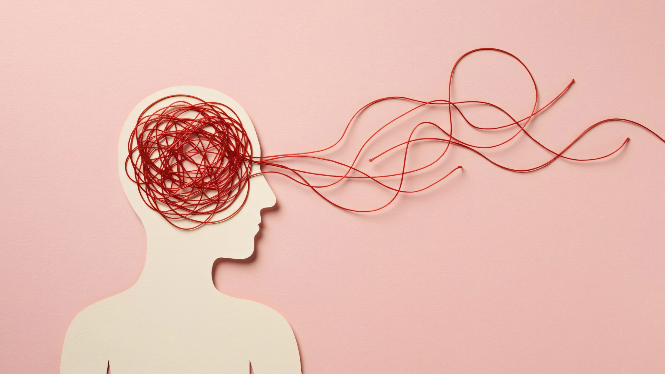 Brain Wealth Habits: Daily Practices to Boost Cognitive Health illustrated by a human head with tangled red lines representing mental stress and thought patterns