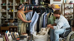 People sorting and upcycling clothes at a thrift store, showcasing thrift store flips: turning old clothes into new favorites