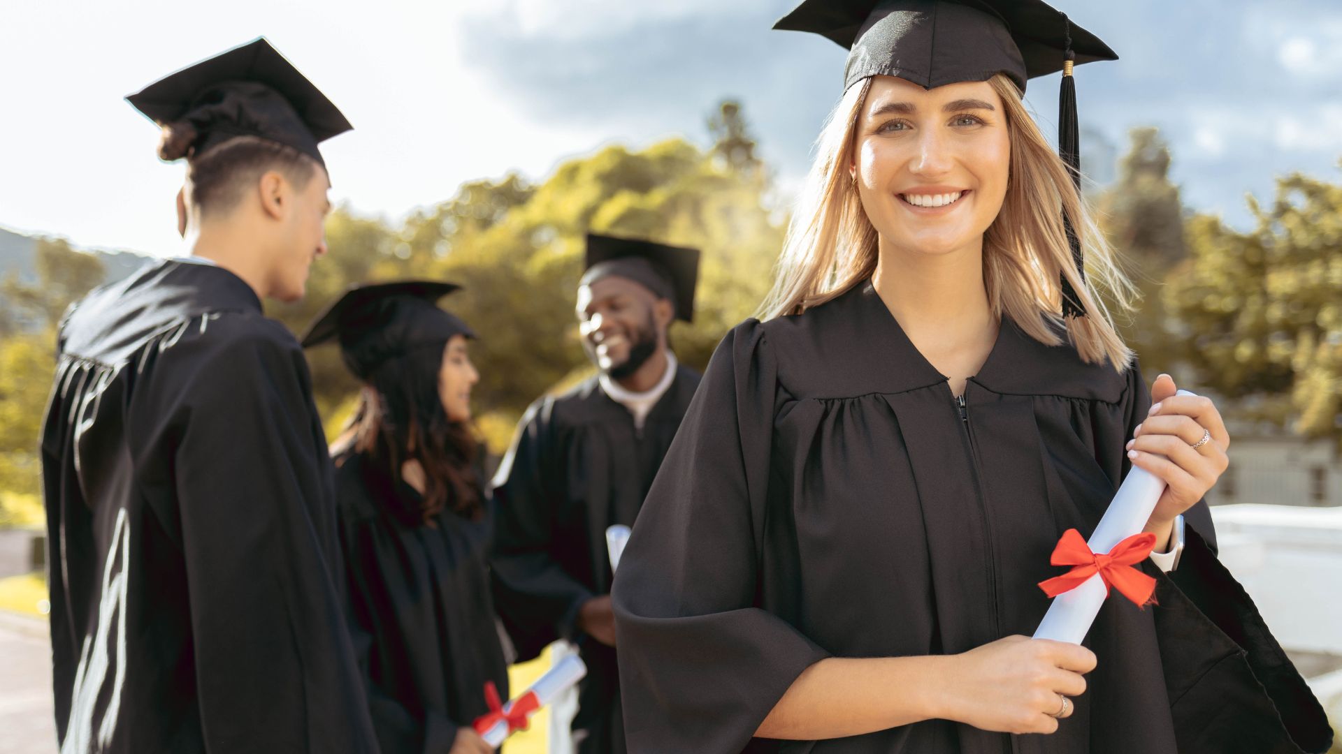 Graduating students representing Esports in Higher Education: Scholarships, Training, and Pro Gaming Careers, highlighting academic pathways and competitive gaming opportunities.