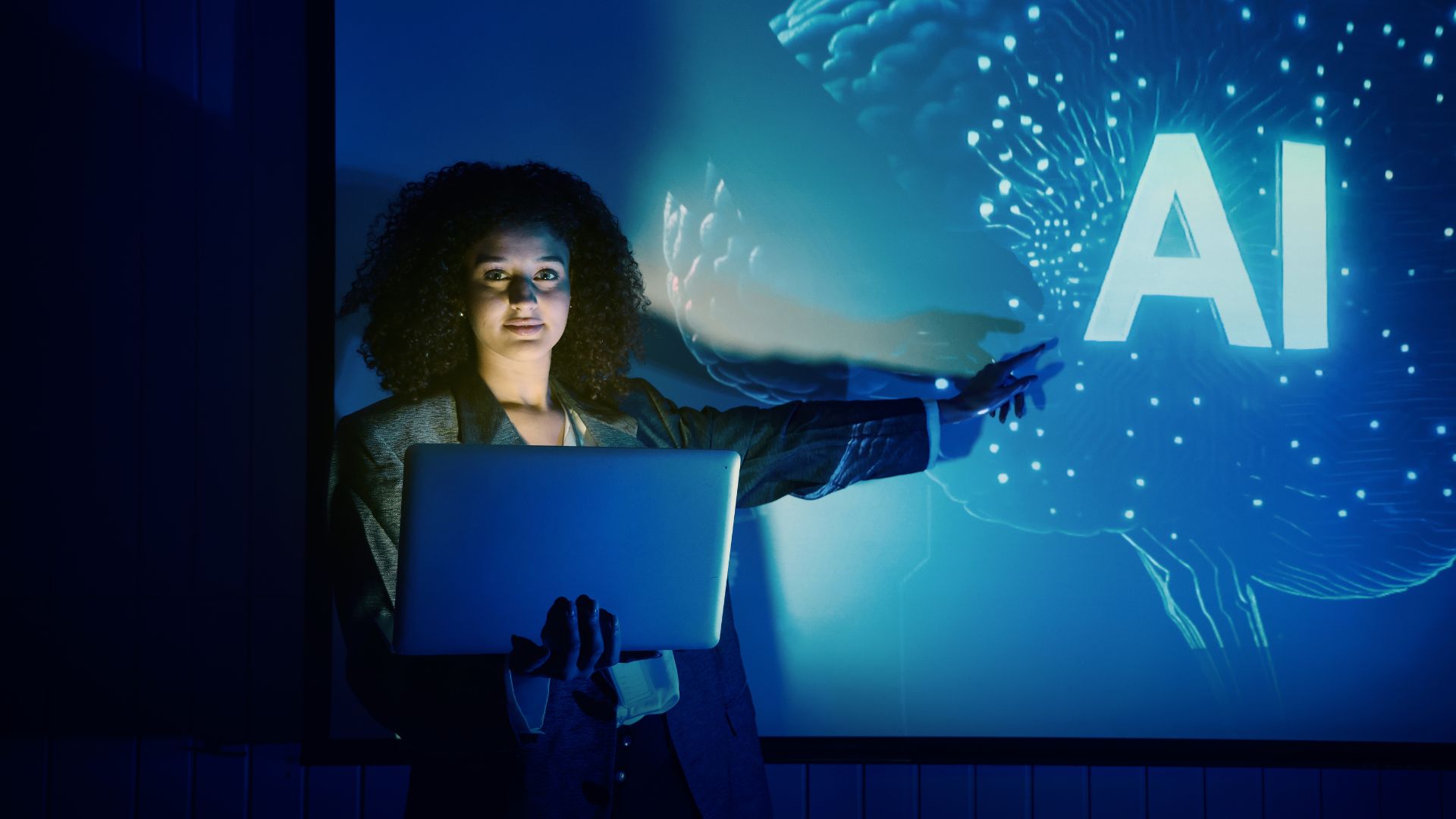 The Best AI Research Tools for Students and Professionals in 2026 – woman using laptop presenting AI technology interface